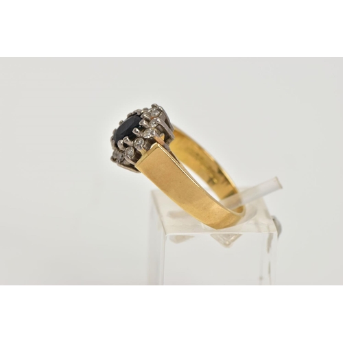 1 - AN 18CT GOLD DIAMOND AND SAPPHIRE CLUSTER RING, centring on an oval cut deep blue sapphire, within a... 