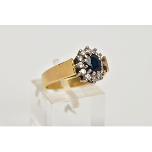 1 - AN 18CT GOLD DIAMOND AND SAPPHIRE CLUSTER RING, centring on an oval cut deep blue sapphire, within a... 