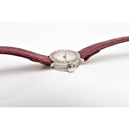 39 - A LADIES DIAMOND SET WRISTWATCH, hand wound movement, round white dial, Arabic numerals, blue hands,... 