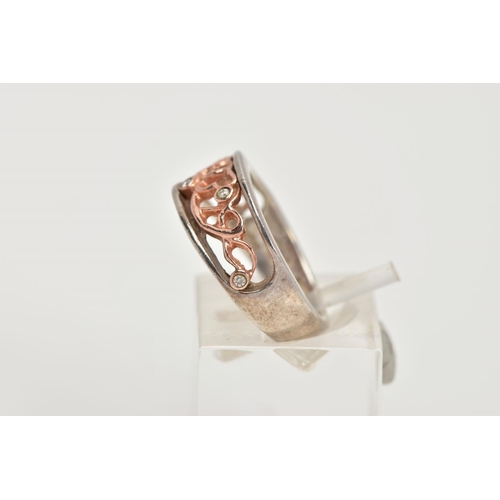 47 - A CLOGAU SILVER AND GOLD RING, designed with a rose gold openwork centre, set with single cut diamon... 