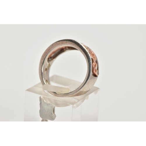 47 - A CLOGAU SILVER AND GOLD RING, designed with a rose gold openwork centre, set with single cut diamon... 