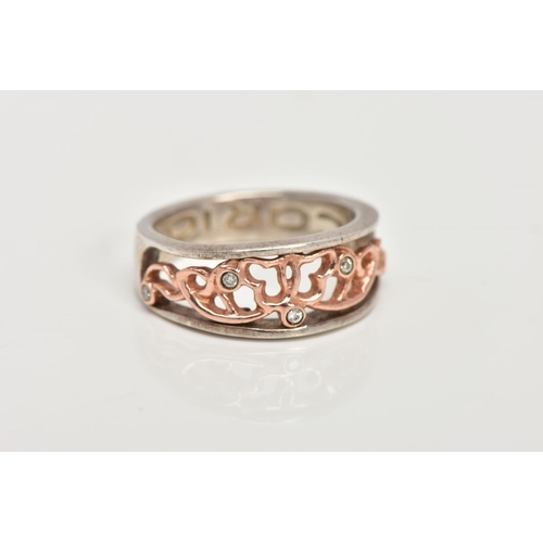 47 - A CLOGAU SILVER AND GOLD RING, designed with a rose gold openwork centre, set with single cut diamon... 