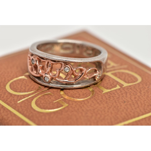 47 - A CLOGAU SILVER AND GOLD RING, designed with a rose gold openwork centre, set with single cut diamon... 