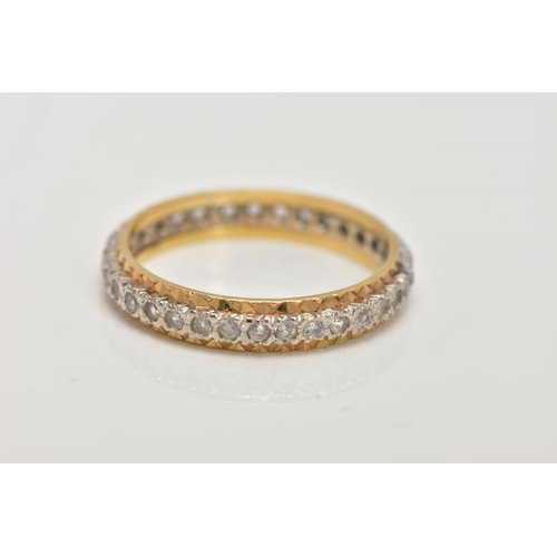 7 - A YELLOW METAL FULL ETERNITY RING, set with colourless spinels, textured gold rim, stamp mark unclea... 