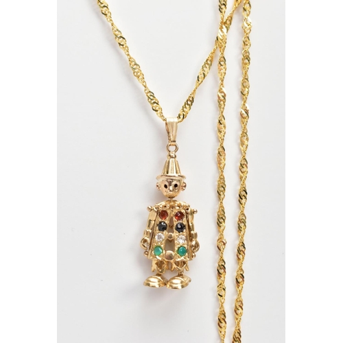 64 - A 9CT GOLD CLOWN PENDANT NECKLACE, the small articulated clown pendant, set with colourful stones to... 