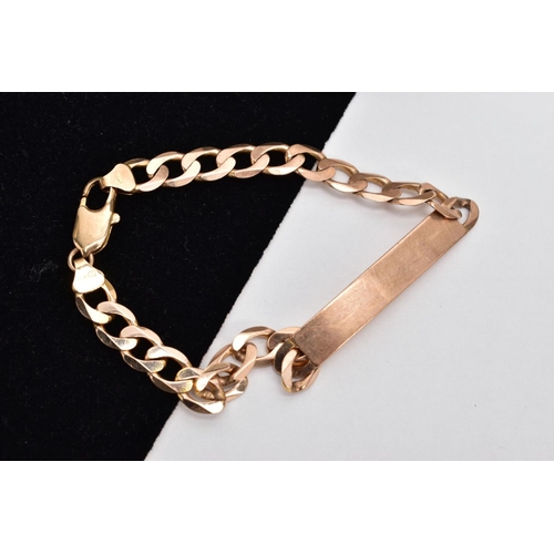 66 - A 9CT GOLD IDENTIFICATION BRACELET, vacant identification panel, on a flat curb link bracelet fitted... 