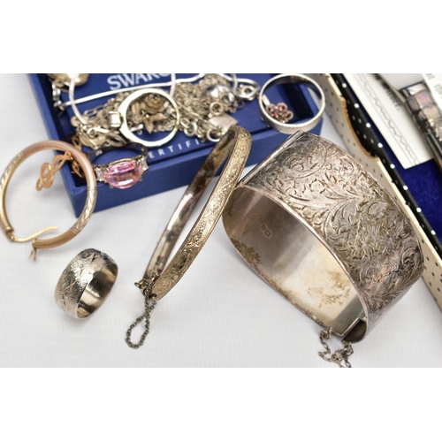 165 - A SELECTION OF SILVER AND WHITE METAL JEWELLERY, to include two silver hinged bangles, each with a f... 