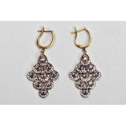 140 - A PAIR OF SILVER GILT DROP EARRINGS, each of a large openwork drop design, set with nine claw set, o... 