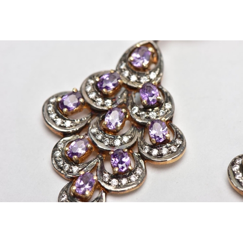 140 - A PAIR OF SILVER GILT DROP EARRINGS, each of a large openwork drop design, set with nine claw set, o... 
