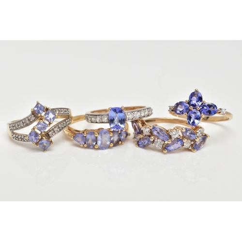 72 - FIVE 9CT GOLD TANZANITE RINGS, five stone tanzanite ring, comprising three oval tanzanite's,  two tr... 