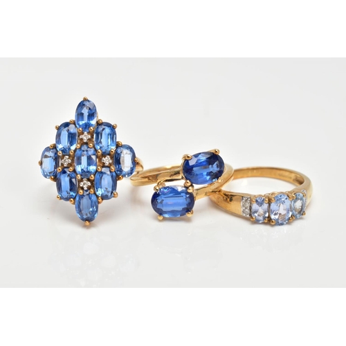 80 - A 9CT GOLD KYANITE RING AND TWO 9CT GOLD TOPAZ RINGS, two stone ring, kyanite oval cut stones, cross... 