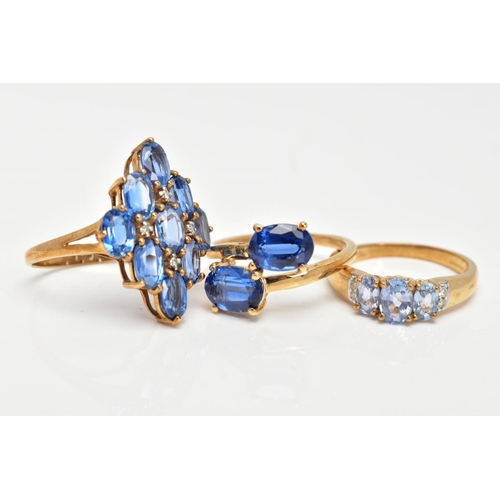 80 - A 9CT GOLD KYANITE RING AND TWO 9CT GOLD TOPAZ RINGS, two stone ring, kyanite oval cut stones, cross... 