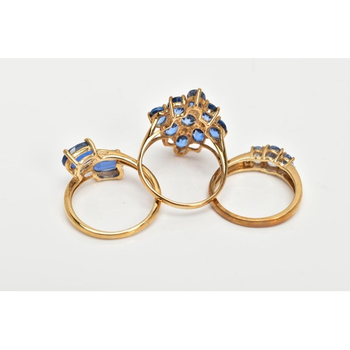 80 - A 9CT GOLD KYANITE RING AND TWO 9CT GOLD TOPAZ RINGS, two stone ring, kyanite oval cut stones, cross... 