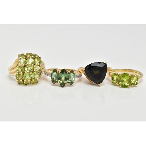 83 - FOUR 9CT GOLD GEMSET RINGS, to include a three stone ring, oval cut peridot, prong set with tapered ... 