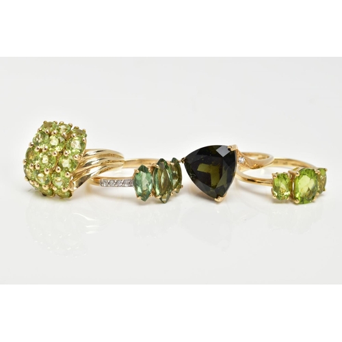 83 - FOUR 9CT GOLD GEMSET RINGS, to include a three stone ring, oval cut peridot, prong set with tapered ... 
