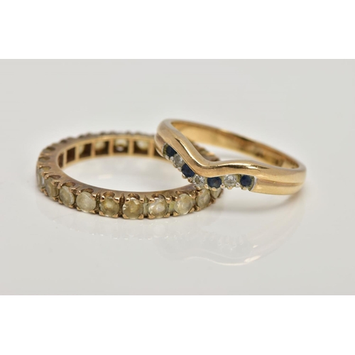 93 - A 9CT GOLD DIAMOND AND SAPPHIRE WISHBONE RING AND A YELLOW METAL FULL ETERNITY RING, designed with a... 