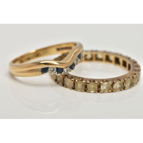 93 - A 9CT GOLD DIAMOND AND SAPPHIRE WISHBONE RING AND A YELLOW METAL FULL ETERNITY RING, designed with a... 