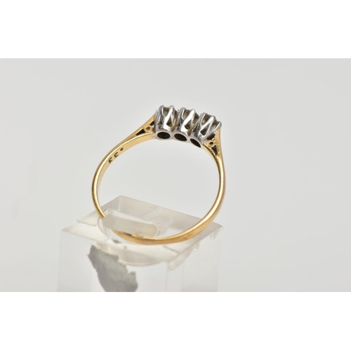 3 - A YELLOW METAL THREE STONE DIAMOND RING, three round brilliant cut diamonds, shared claw setting, st... 