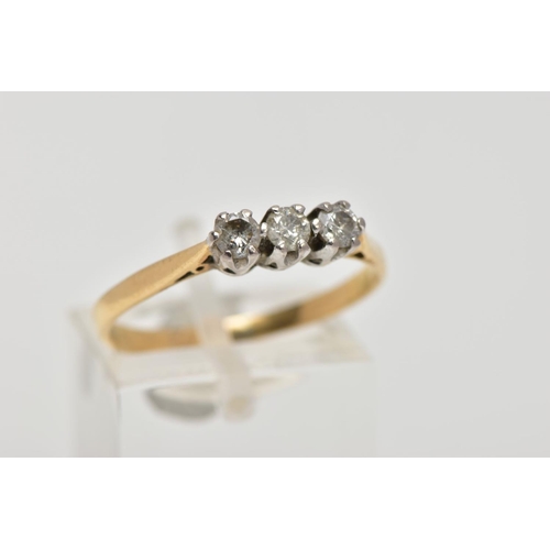 3 - A YELLOW METAL THREE STONE DIAMOND RING, three round brilliant cut diamonds, shared claw setting, st... 
