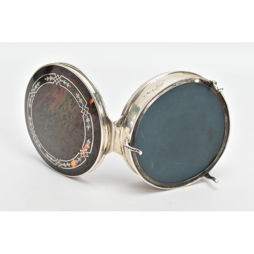 101 - A SILVER AND TORTOISESHELL BOX, of a circular form, plain polished body raised on three scroll feet,... 