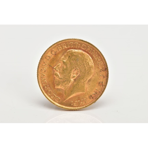32 - AN EARLY 20TH CENTURY FULL SOVEREIGN, depicting King George V, with George and the dragon to the rev... 