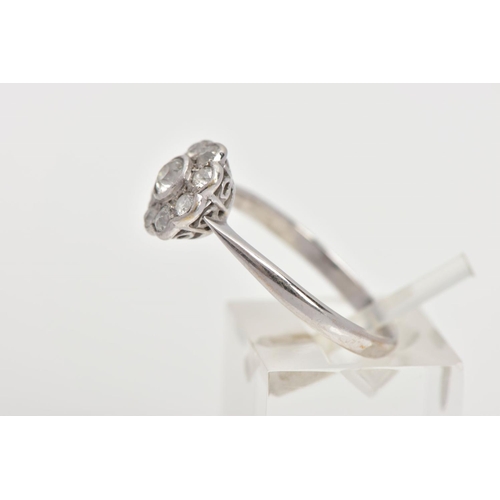 35 - A DIAMOND CLUSTER RING, white metal flower shape cluster set with nine old cut diamonds, estimated t... 