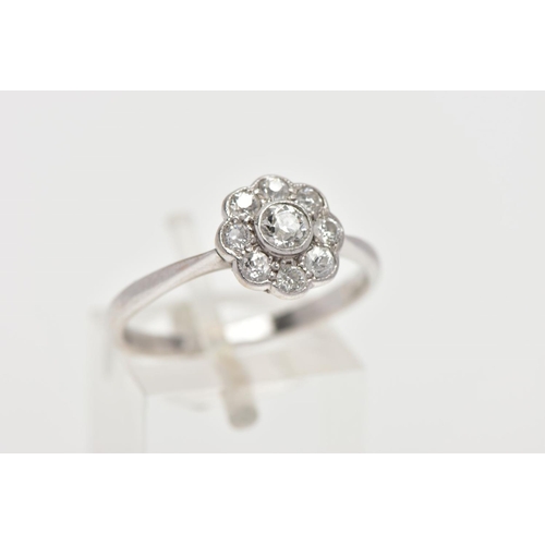 35 - A DIAMOND CLUSTER RING, white metal flower shape cluster set with nine old cut diamonds, estimated t... 