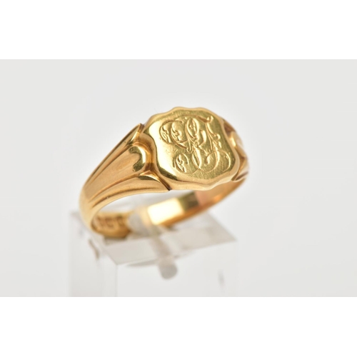 6 - AN 18CT GOLD GENTLEMENS SIGNET RING, shield shaped signet with engraved initials, textured shoulders... 