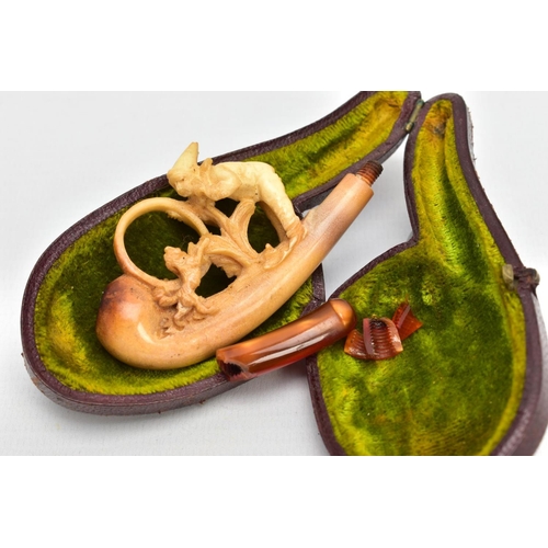 186 - A MEERSCHAUM CARVED PIPE, AF a carved pipe depicting a boy and a dog, together with original fitted ... 
