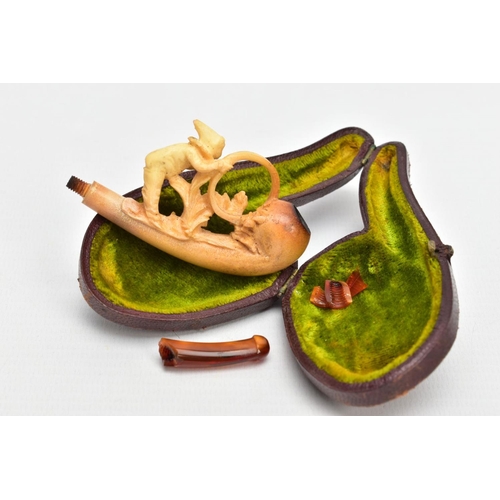 186 - A MEERSCHAUM CARVED PIPE, AF a carved pipe depicting a boy and a dog, together with original fitted ... 