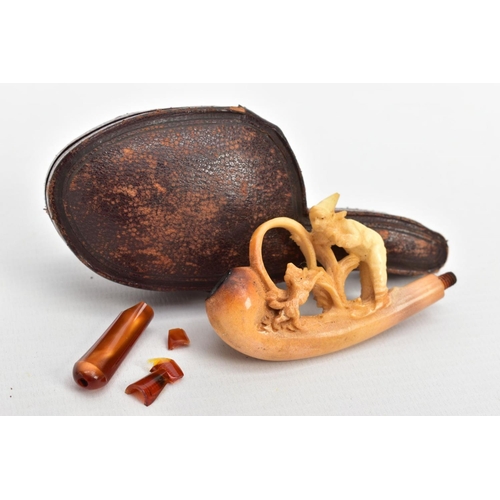 186 - A MEERSCHAUM CARVED PIPE, AF a carved pipe depicting a boy and a dog, together with original fitted ... 