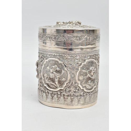 198 - A WHITE METAL POT, embossed with south Asian artwork, the pot with a removable lid depicts two boys ... 