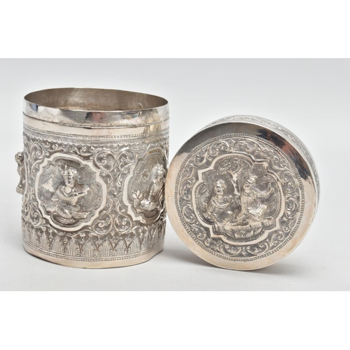 198 - A WHITE METAL POT, embossed with south Asian artwork, the pot with a removable lid depicts two boys ... 