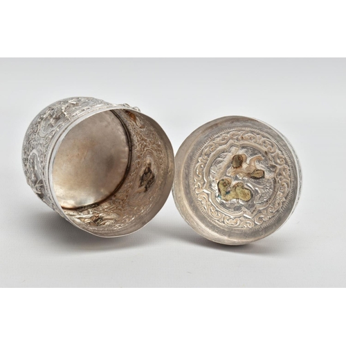 198 - A WHITE METAL POT, embossed with south Asian artwork, the pot with a removable lid depicts two boys ... 
