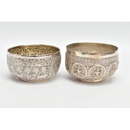 199 - TWO WHITE METAL DISHES, two dishes embossed with south Asian artwork, one dish embossed with deities... 