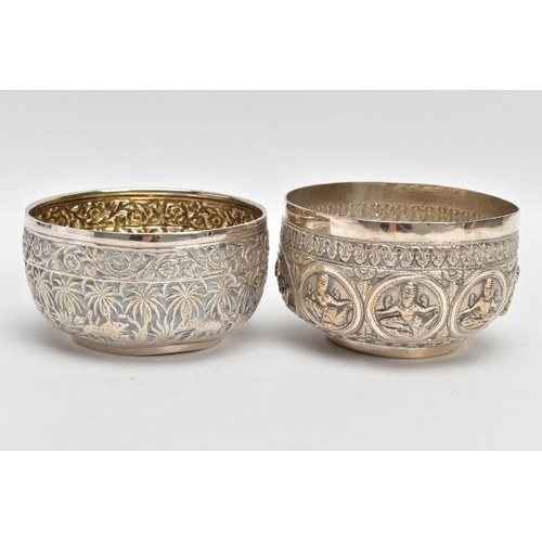 199 - TWO WHITE METAL DISHES, two dishes embossed with south Asian artwork, one dish embossed with deities... 