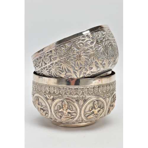 199 - TWO WHITE METAL DISHES, two dishes embossed with south Asian artwork, one dish embossed with deities... 