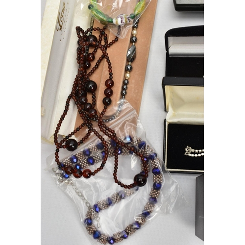 209 - A BOX OF ASSORTED COSTUME JEWELLERY, to include seven white metal rings each set with cubic zirconia... 