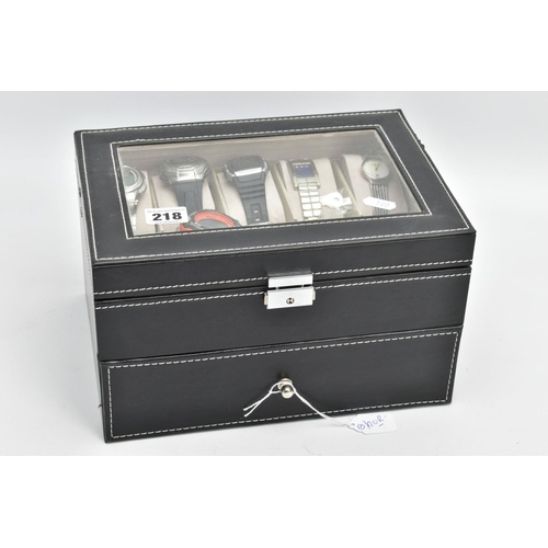 218 - A WATCH DISPLAY CASE WITH ASSORTED WATCHES, a black watch case with twelve assorted watches included... 