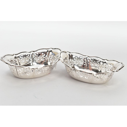 220 - TWO SILVER BONBON DISHES, each of an oval pierced from, wavy rims, hallmarked 'William Comyns & Sons... 