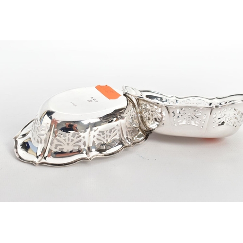220 - TWO SILVER BONBON DISHES, each of an oval pierced from, wavy rims, hallmarked 'William Comyns & Sons... 