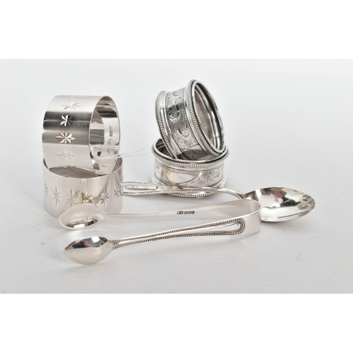 222 - FOUR SILVER NAPKIN RINGS, A PAIR OF SUGAR TONGS AND A TEASPOON, two napkin rings engraved with star ... 