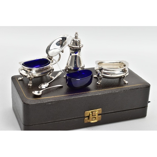 223 - A CASED GEORGE VI SILVER CONDIMENT SET, to include a silver salt and mustard each with a blue glass ... 
