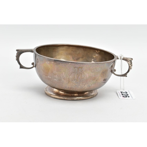 226 - A SILVER PORRIDGER, plain polished design with an engraved monogram, fitted with double handles on a... 