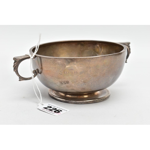 226 - A SILVER PORRIDGER, plain polished design with an engraved monogram, fitted with double handles on a... 