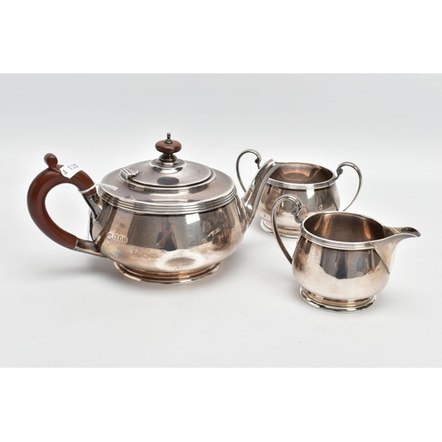 233 - A THREE PIECE SILVER TEA SET, to include a silver round teapot with a brown insulated handle, detail... 