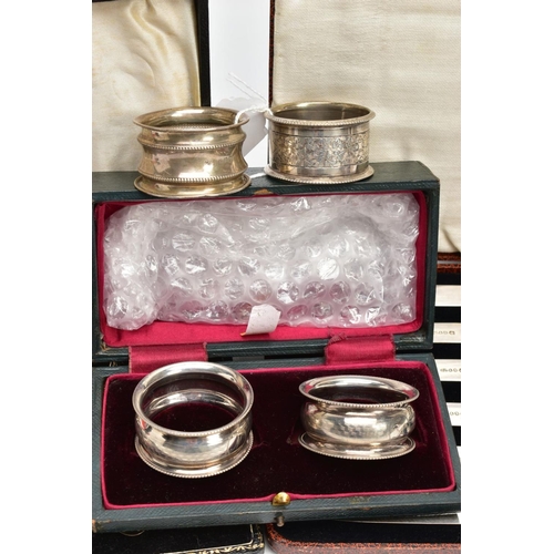 235 - A SELECTION OF SILVER ITEMS, to include a cased set of two concave circular napkin rings, with an en... 