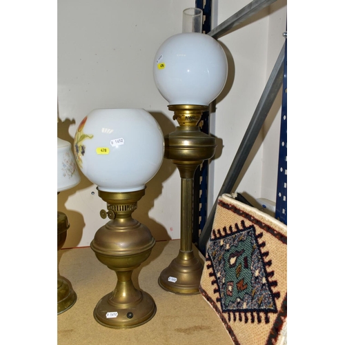 478 - TWO 2OTH CENTURY BRASS BASED OIL LAMPS, A TABLE LAMP IN A SIMILAR STYLE AND TWO TURKISH SYNTHETIC RU... 