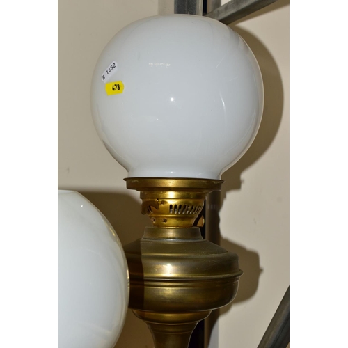 478 - TWO 2OTH CENTURY BRASS BASED OIL LAMPS, A TABLE LAMP IN A SIMILAR STYLE AND TWO TURKISH SYNTHETIC RU... 