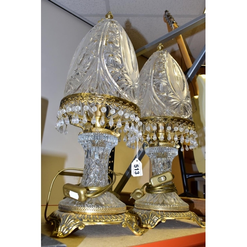 513 - A PAIR OF KLEIN BACCARAT CRYSTAL TABLE LAMPS, with a diamond cut crystal body on a brass base, elong... 